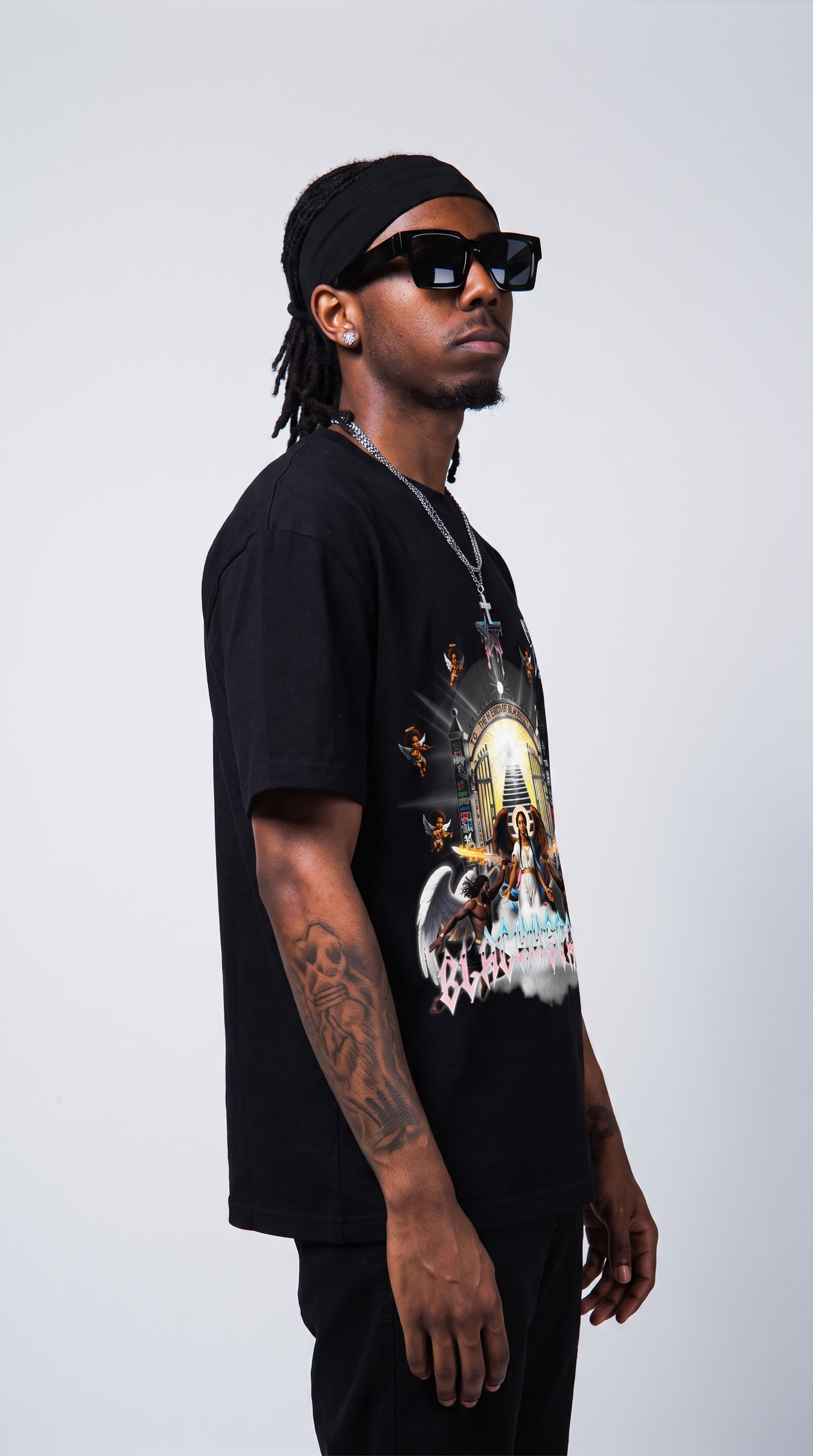 Divine by Design tee — three-quarter profile, oversized fit