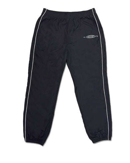 Black track pants with white stripes on a white background