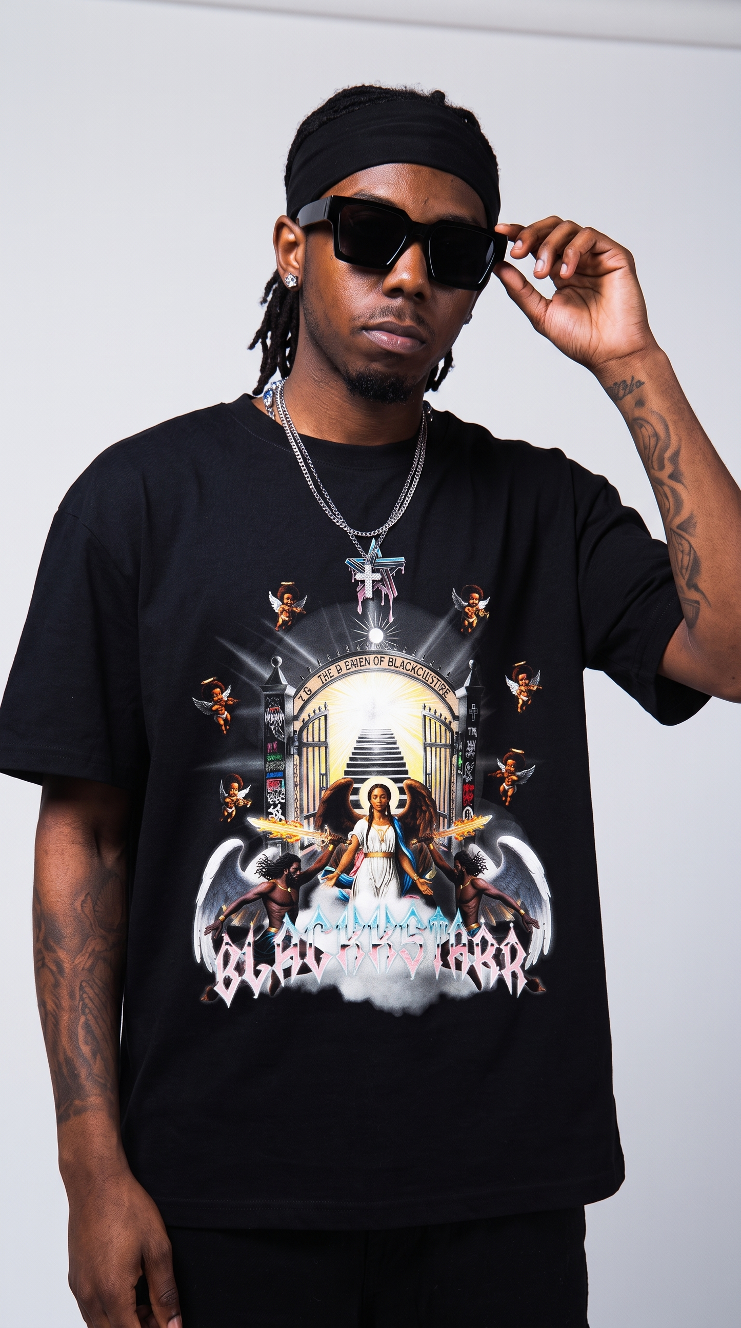 Divine by Design tee — close editorial, graphic dominant